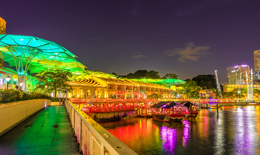 Clarke Quay bridge and Riverside area at evening in Singapore