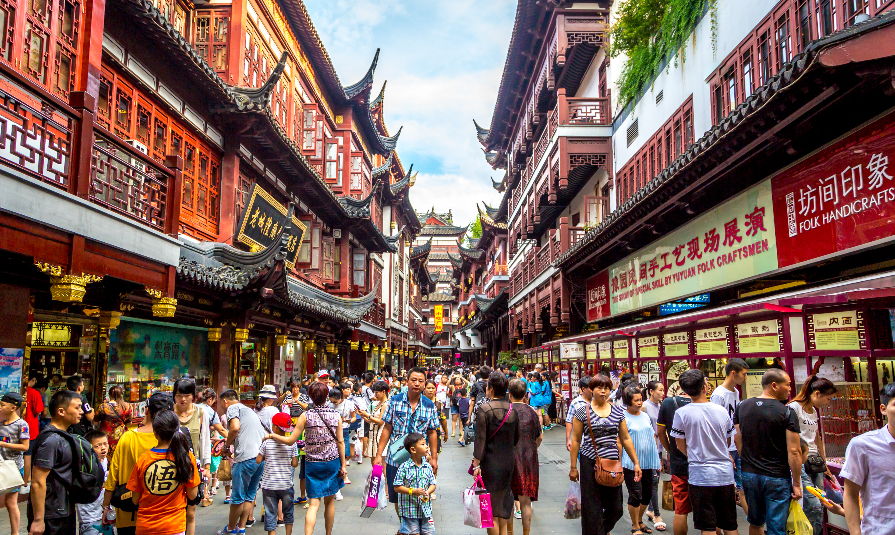 Local and tourists enjoying a warm summer day in downtown Shanghai in China, Asia