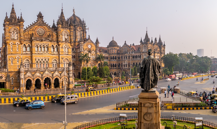 Statue of Pherozeshah Mehta known as The Lion of Bombay with CST station