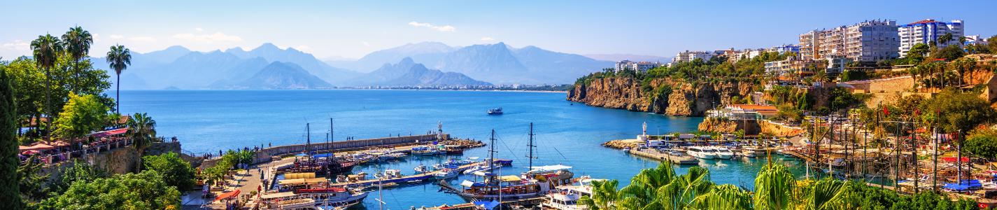 Panoramic view of Antalya Old Town port, Taurus mountains and Mediterrranean Sea, Turkey