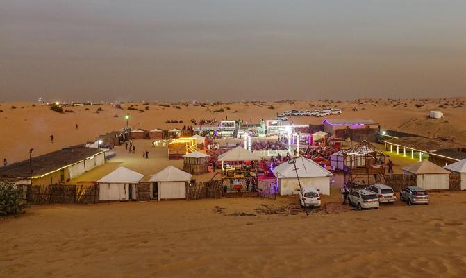  Bedouin camp on the Dubai desert at sunset.
