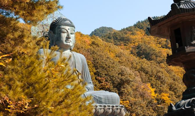 Big Buddha Monument of Sinheungsa Temple in Autumn. Seoraksan National Park, Sokcho, South Korea.