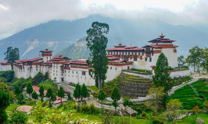 Central Bhutan, the Trongsa Dzong, the biggest forteress in Bhutan. Situated on hill and overlooking green the valley. 