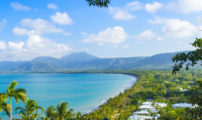 Four Mile Beach in Port Douglas in Tropical North Queensland with blue water