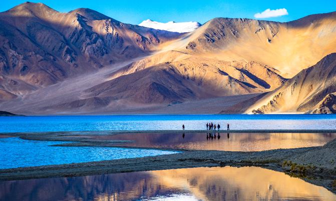 Leh, Ladakh,  India Landscape with reflections of the mountains on the  lake named Pagong Tso, situated on the border with India and China.