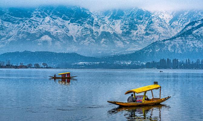 Srinagar, Kashmir, India  A view of Dal Lake in winter, and the beautiful mountain range in the background in the city of Srinagar, Kashmir, India.