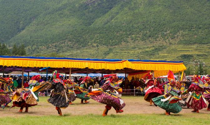 Wangdue Prodrang, Bhutan- A festival of mask and folk dances  performed at Tencholing Army Ground.  It is a event where communities come together to witness religious mask dances.